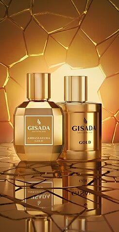 Dva flakony parfému Gisada Ambassador Gold v luxusním zlatém designu na elegantním zlatém pozadí.